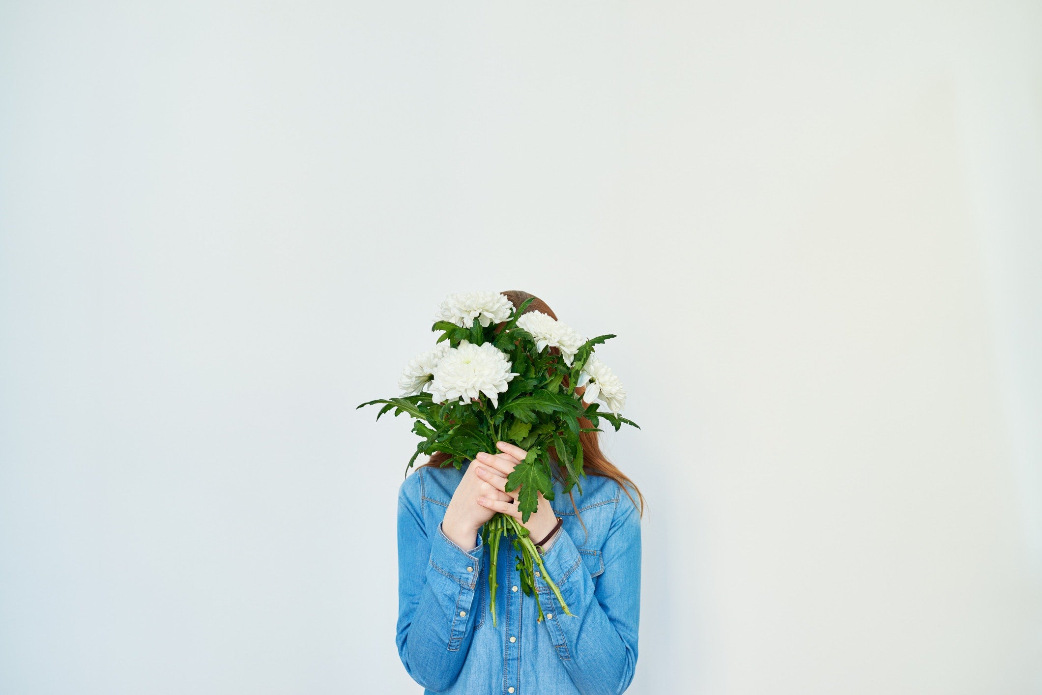 lady Covering Her Face with Flowers