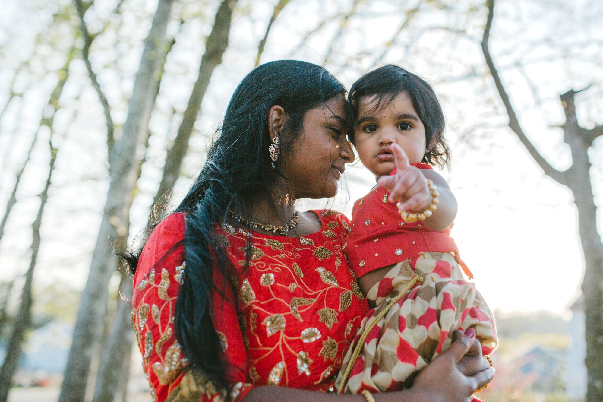 mother holding her daughter in her arms