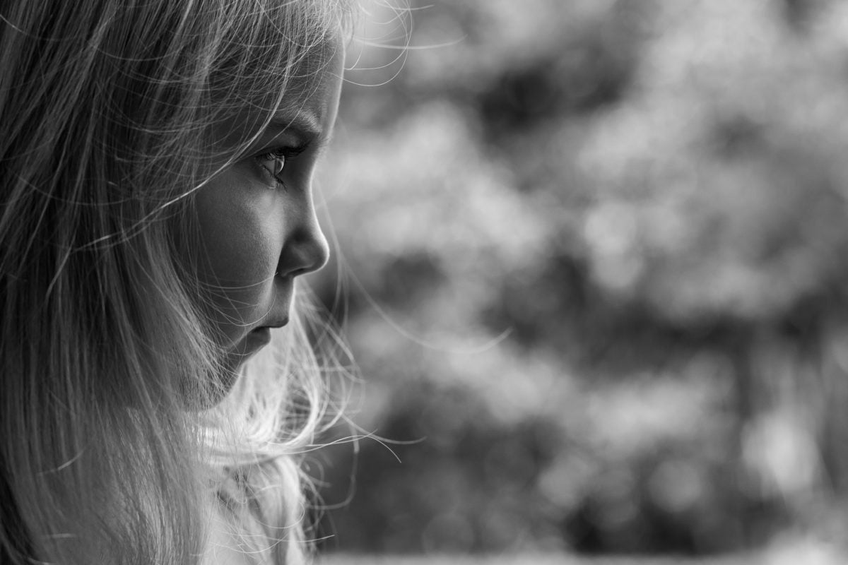 Young Girl Staring at distance with Angry Facial Expression