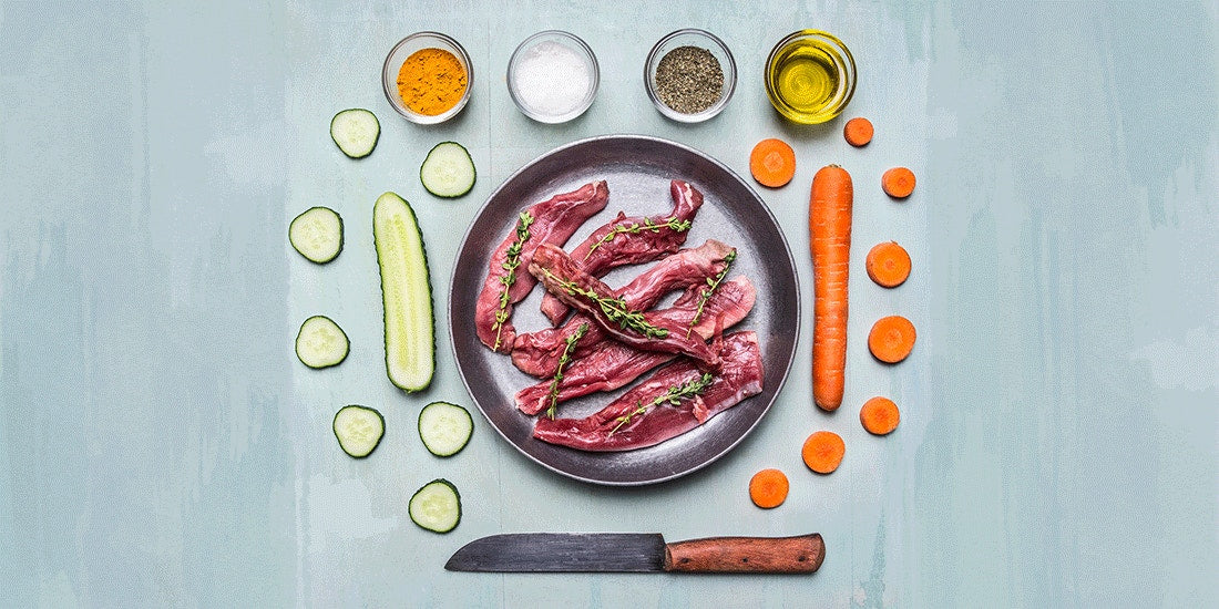 meat in pan surrounded by ingredients