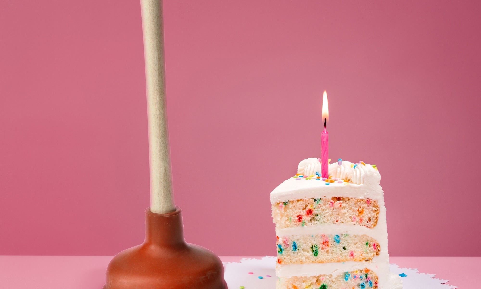 Close-up Of Lit Candle On Pastry