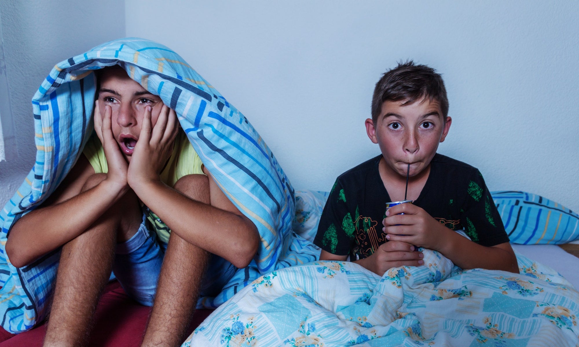 two boys watching horror movie