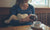 mother breast feeding cute baby in arms at cafe