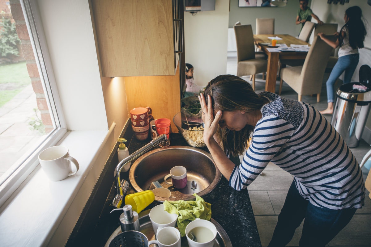 exhausted mother in kitchen