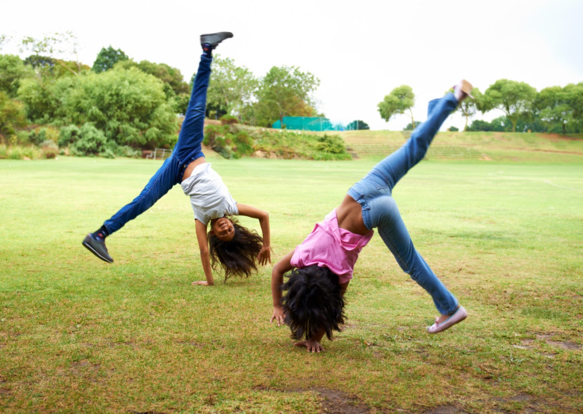 young girls doing somersaults
