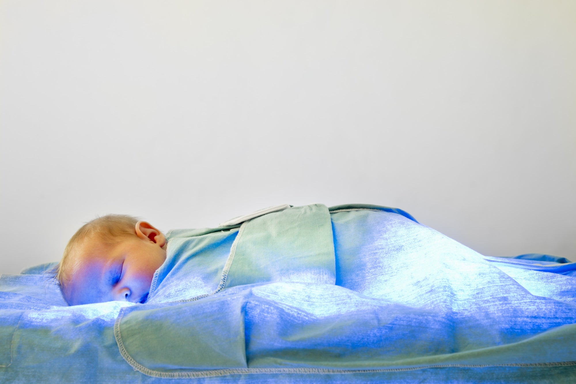 Baby sleeping on blue blanket