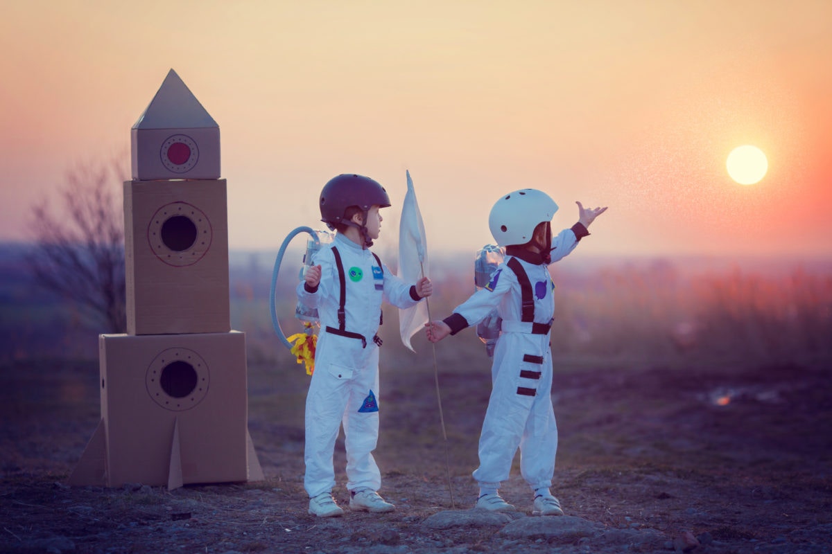 young boys in astronaut costume