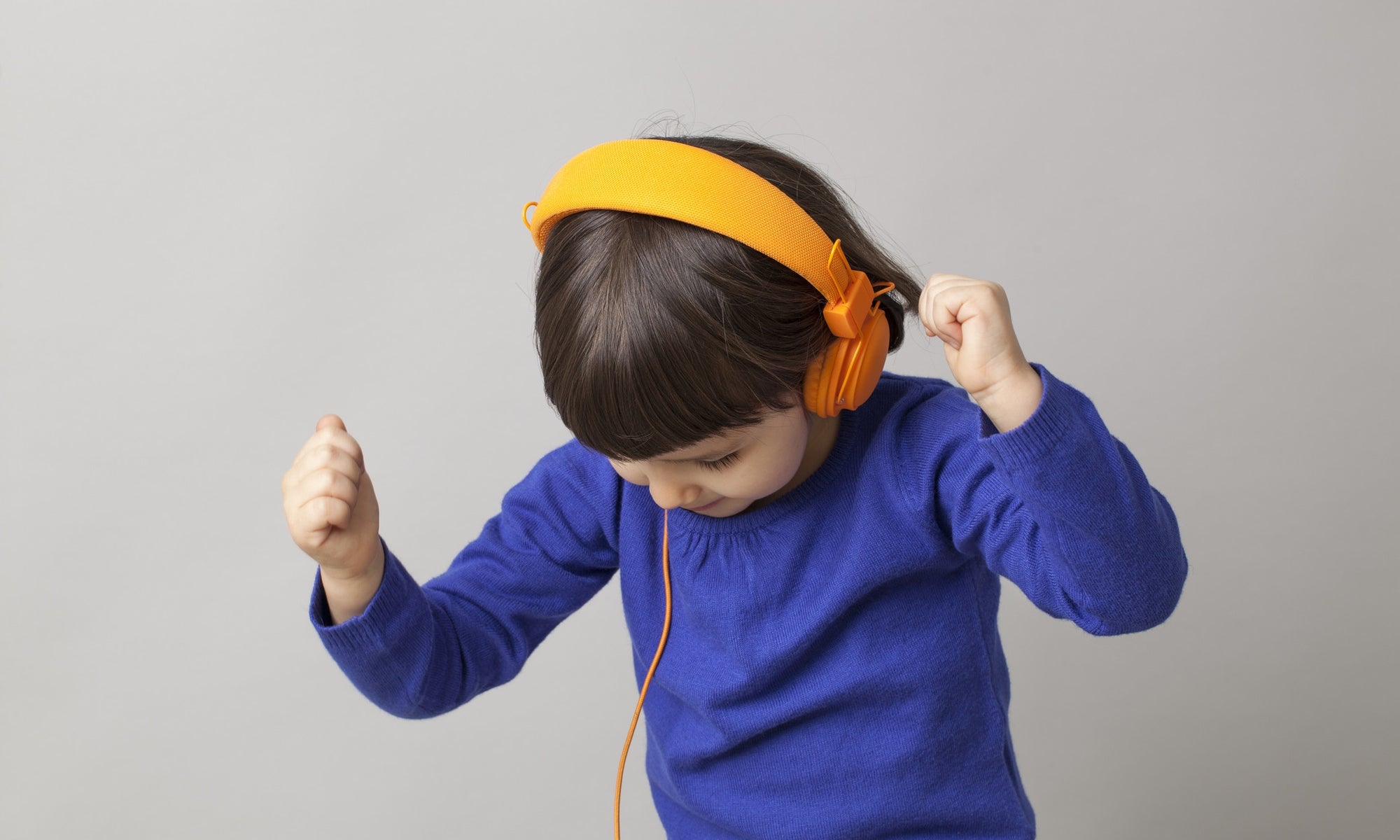 young boy listen music with headphone