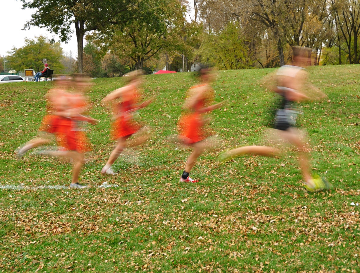 blurred image of group of girls running outdoors