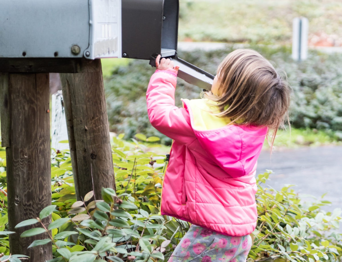 Kid checking post box