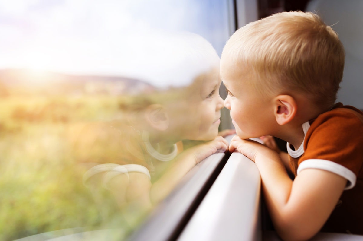 little boy looking out of the window