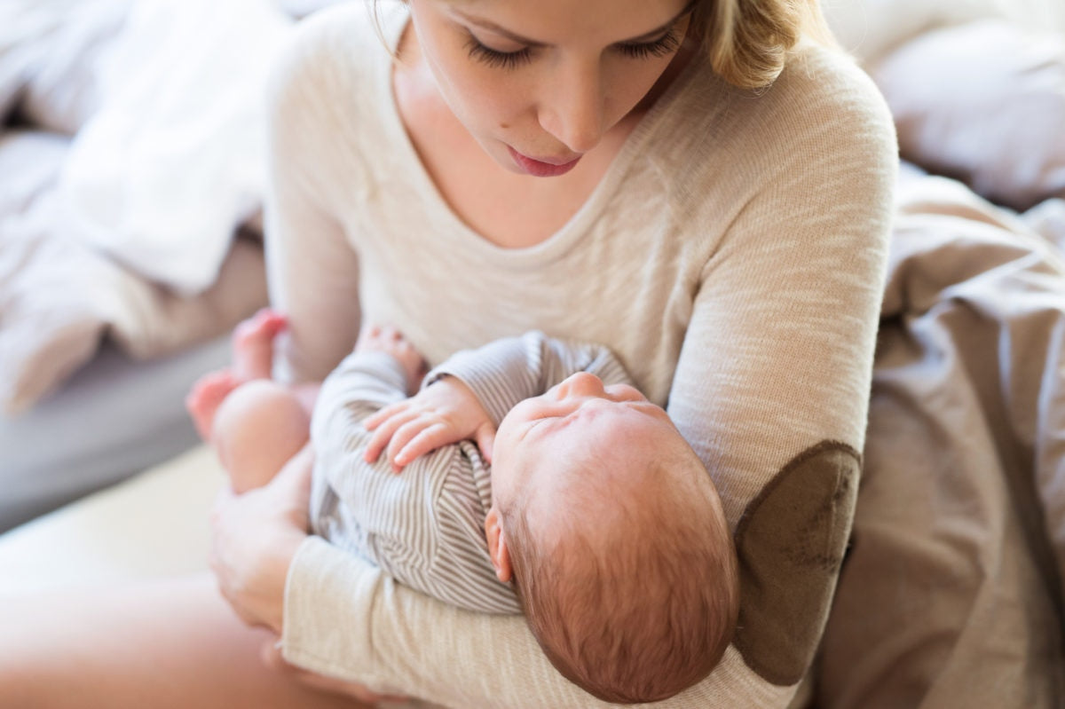 mom holding baby