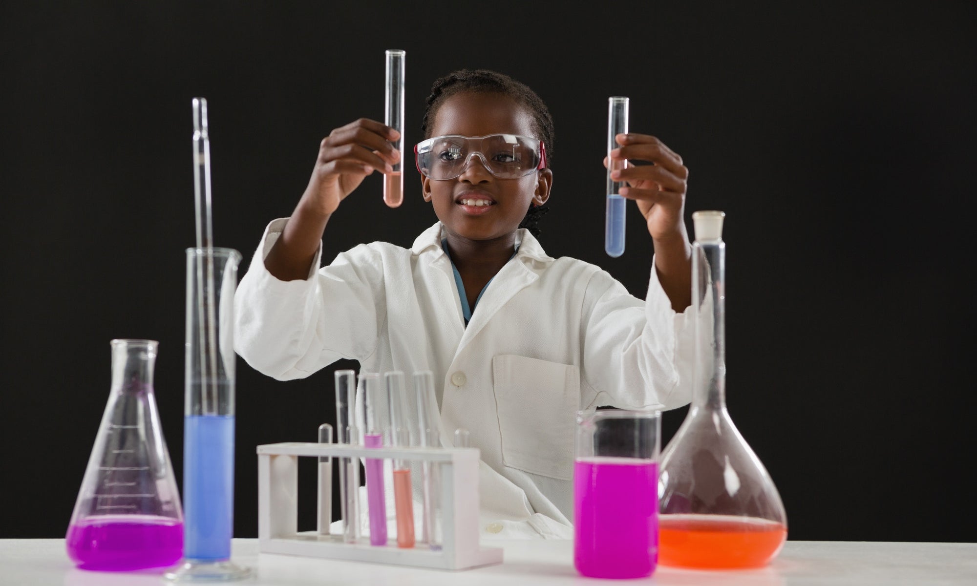 student doing chemistry test with liquids and tubes