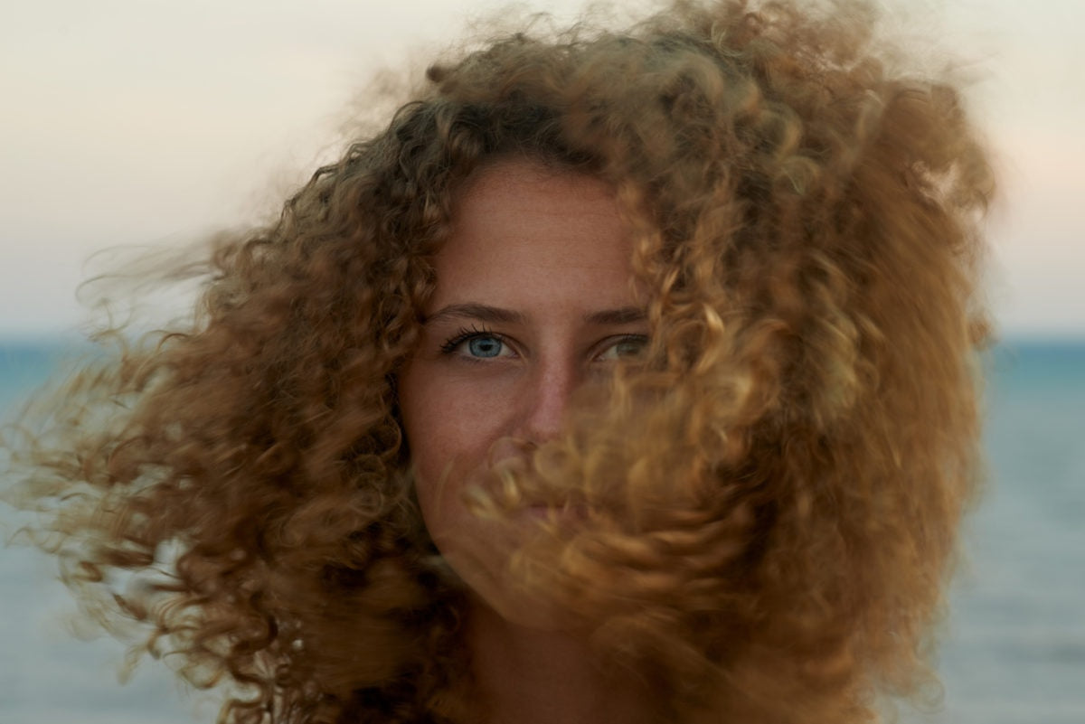 A girl with curly blonde hair