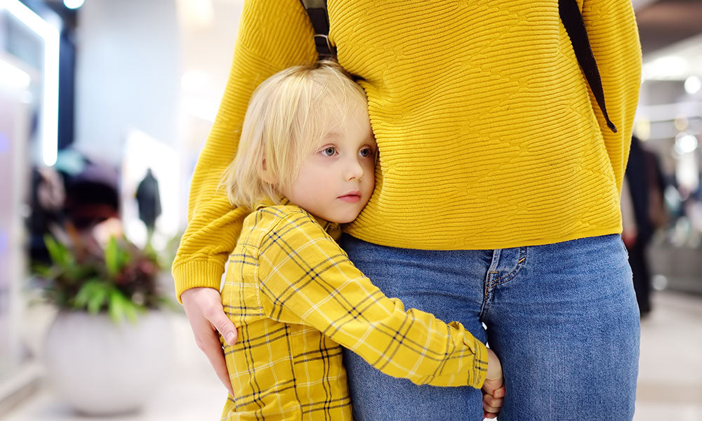boy hugging mother
