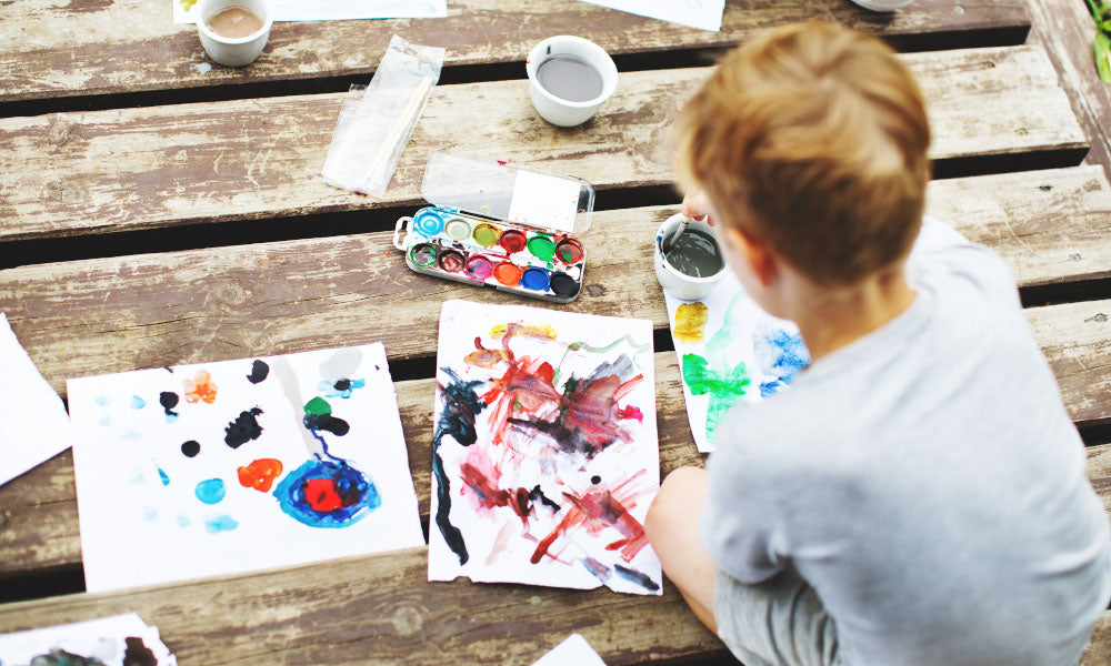 young boy painting