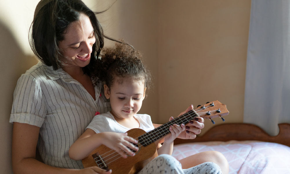 child playing play musical instrument