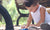 little boy playing with toy car