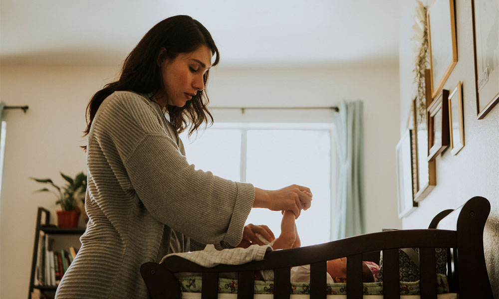 mother changing baby