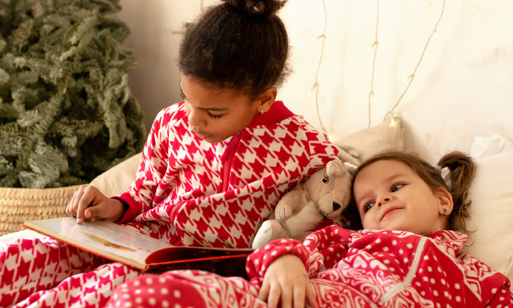 sisters reading books in christmas day
