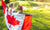 two cute female kids with Canadian flag.