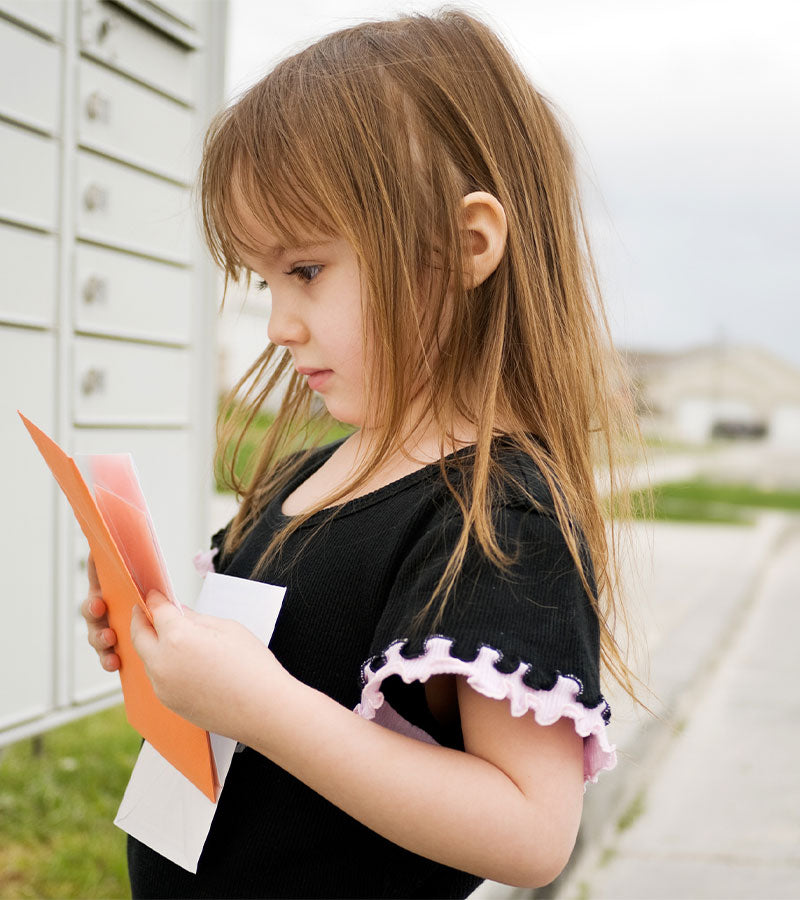 child checking mail